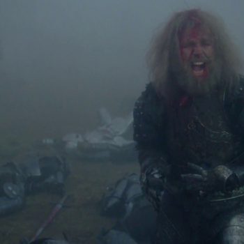 Nicholas Clay as the aged Lancelot in John Boorman's "Excalibur" embodies the tragic cost of a lifetime of questing. Aged knight in tattered armor with long gray hair sitting in misty battlefield from 1981 Excalibur film.